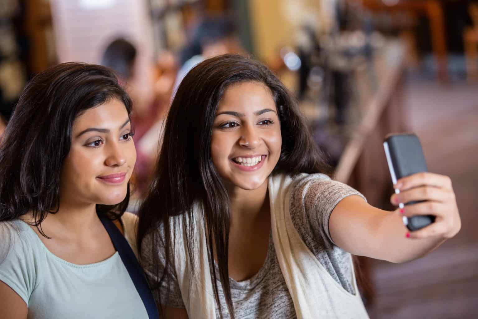two young girls taking a selfie