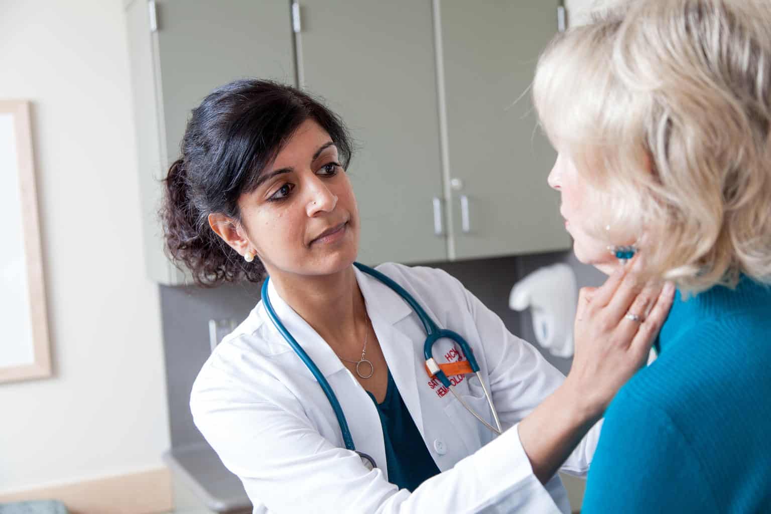 cardiooncology physician examining female patient