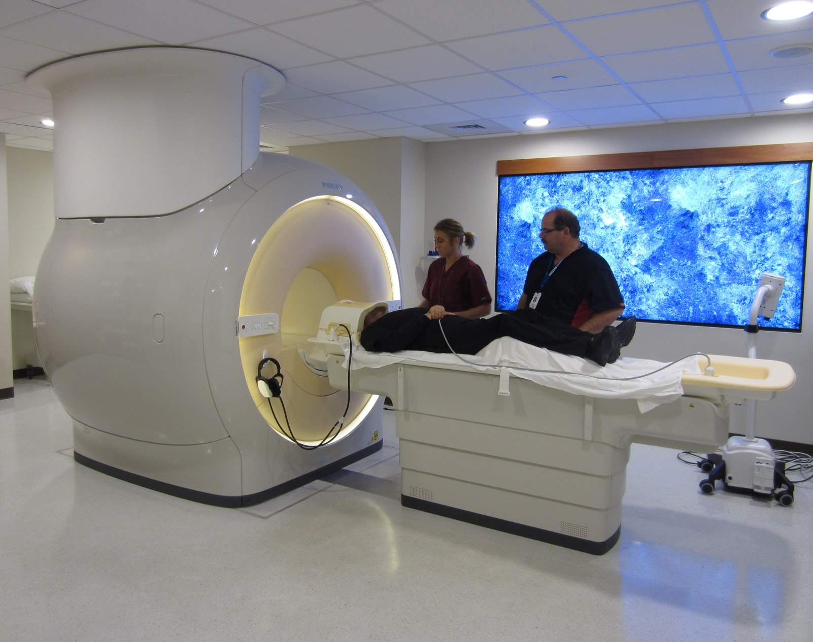 Whittier techs assisting patient with MRI machine