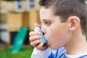 boy using inhaler