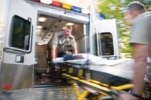 Paramedics entering ambulance