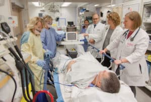 staff with patient in emergency room