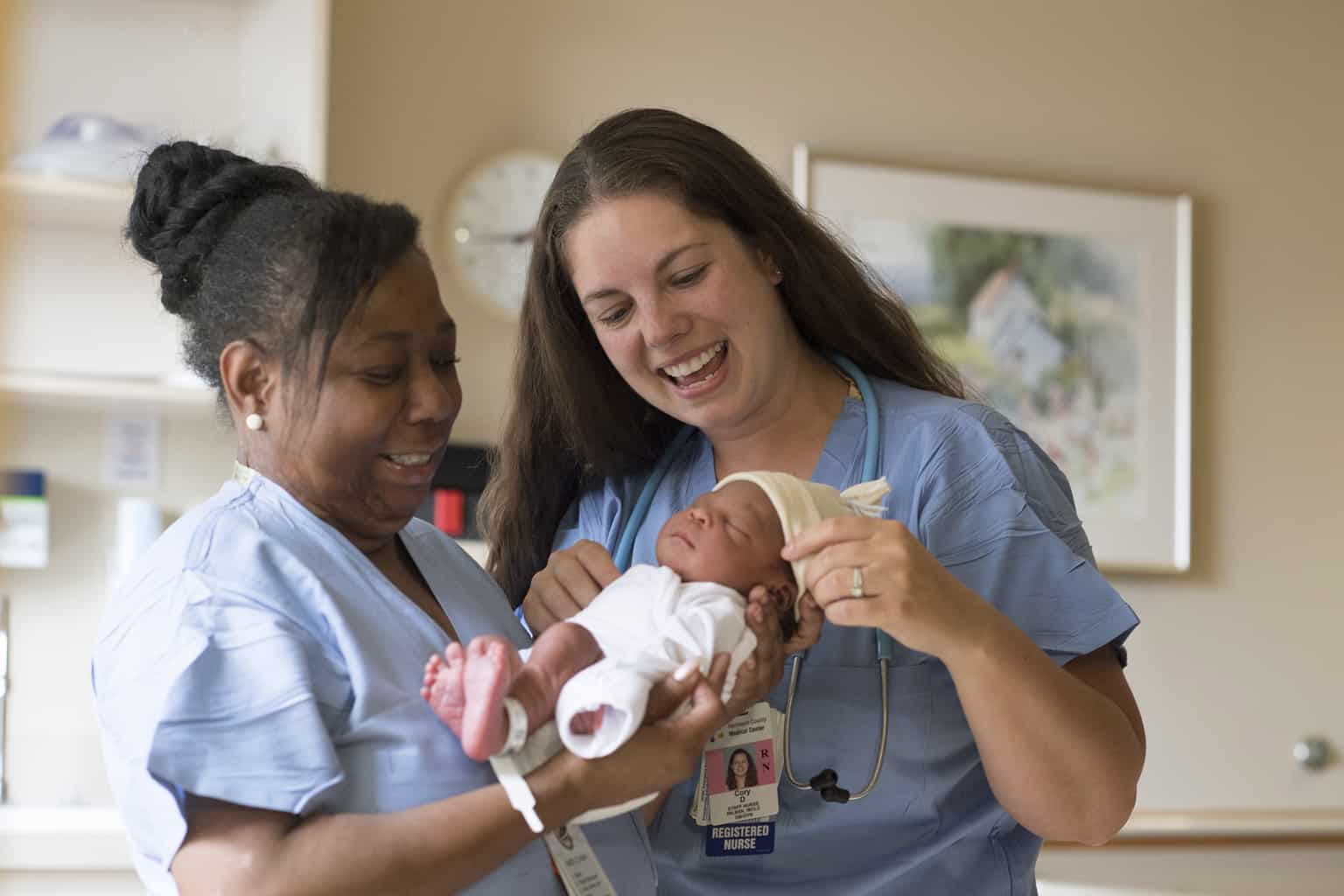 birth center staff with newborn baby