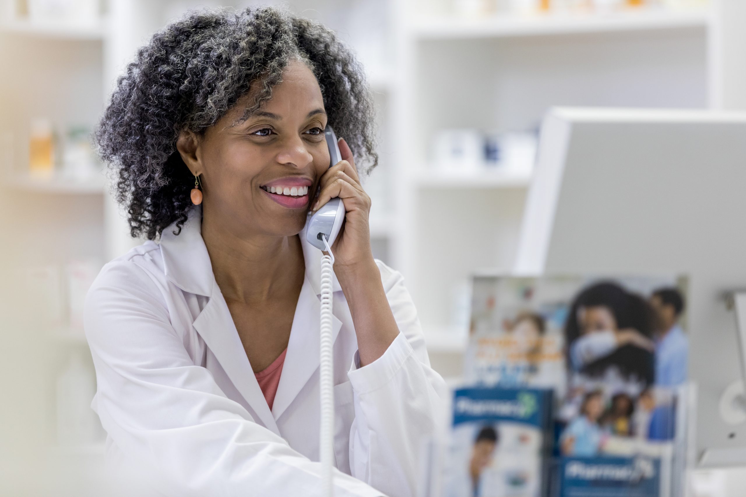 Pharmacist consults computer records for patient, refers, one call medical, medical connect, medical referral, medical referrals
