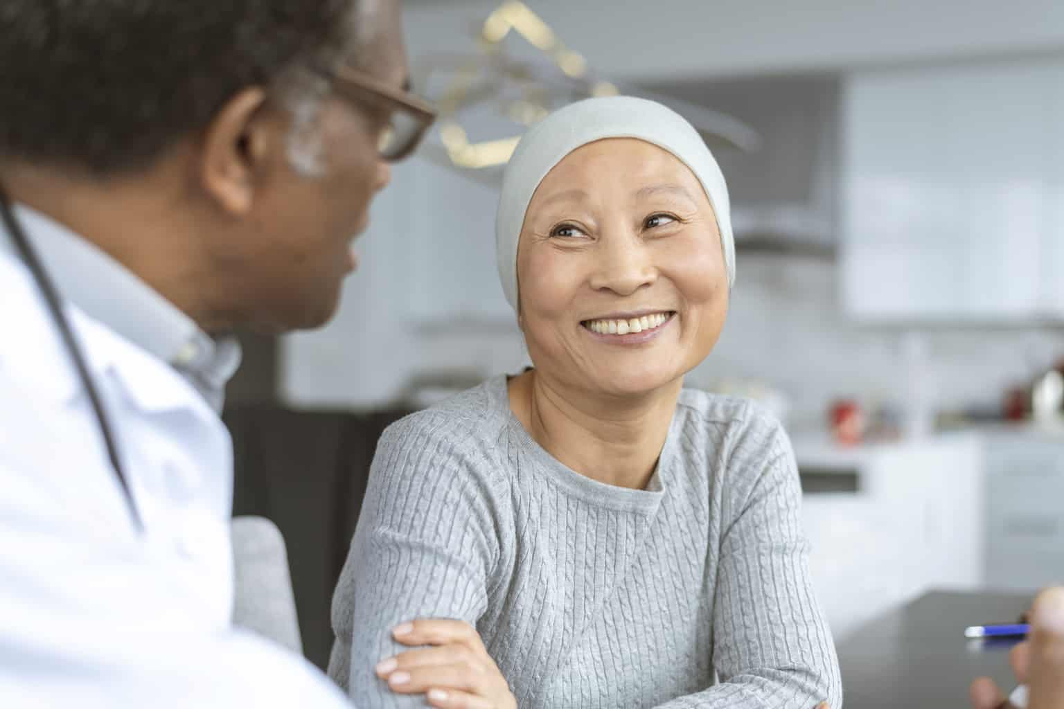 woman cancer survivor with doctor