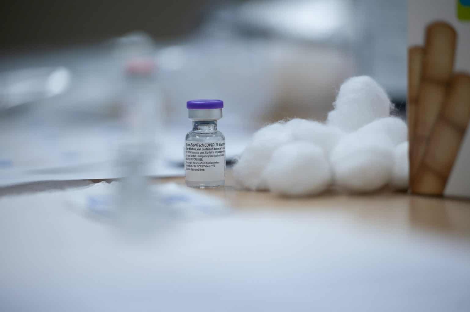 vaccine vial with cotton balls in lab