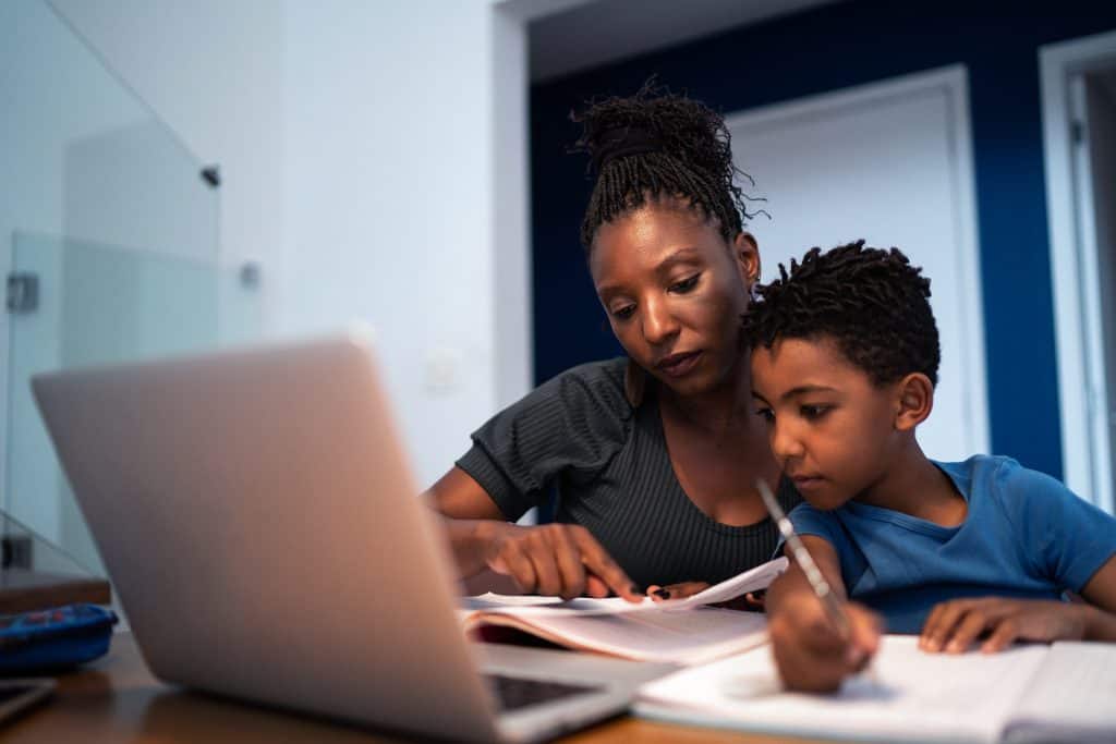 mother helping son with homework
