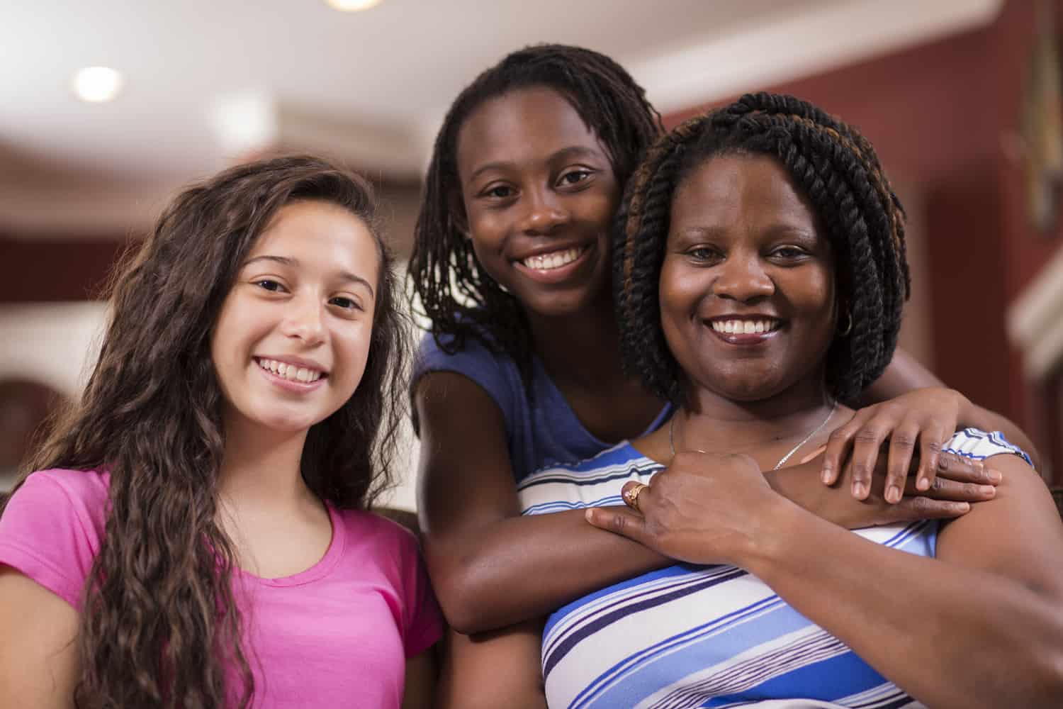 mom with her daughters, resources for teens, resources for parents and caregivers, teen sexual health info, teen health support