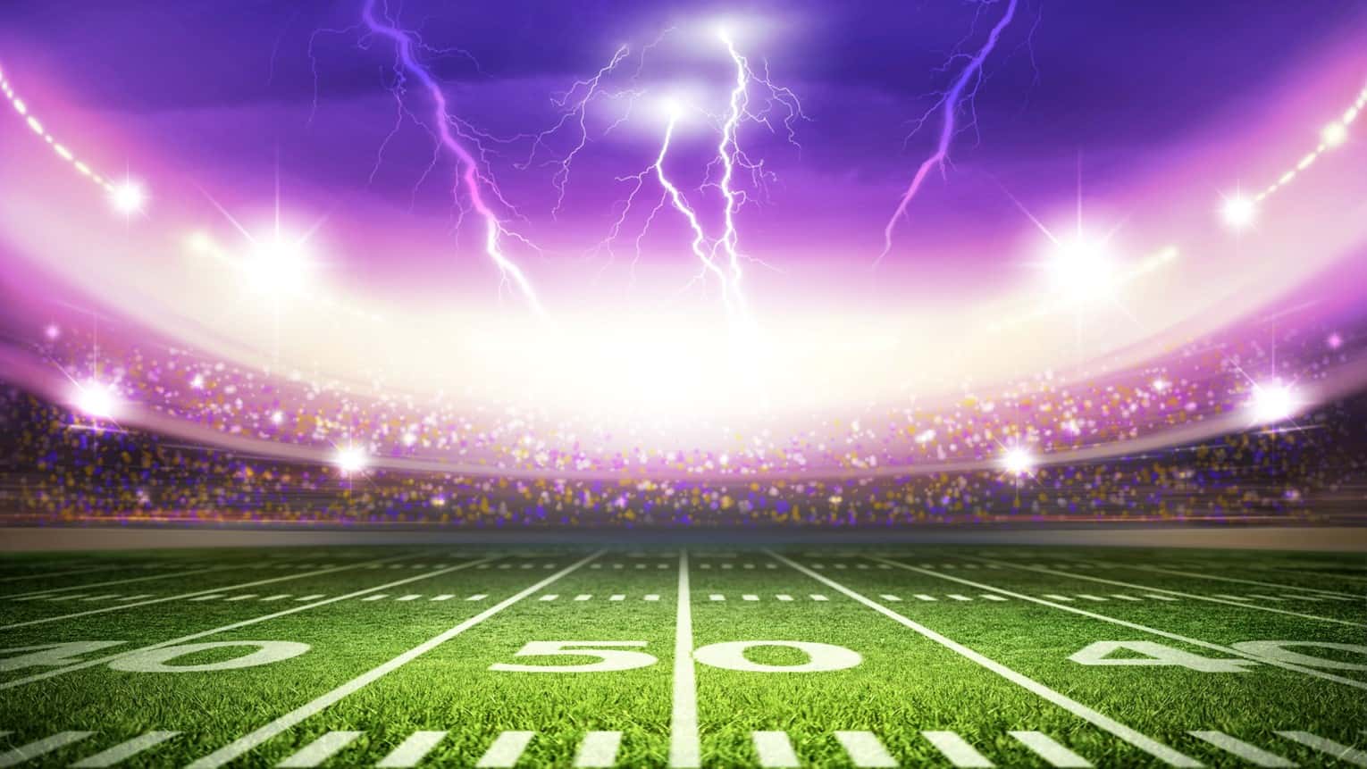 football field with purple sky and lightening