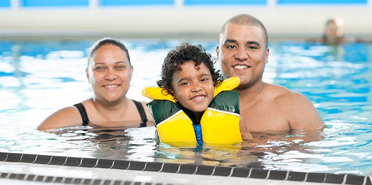 parents with child in swimming pool, the grizzly bear in your neighbor's backyard, unintentional drowning, water safety tips for parents, unanticipated access, water watcher, ifelayo ojo md, swimmming lessons