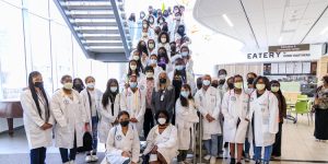 young black women attending the black women with stethoscopes youth summit at hennepin healthcare, black women with stethoscopes, youth summits, delivering culturally-centered care, hands-on experience, simulation center