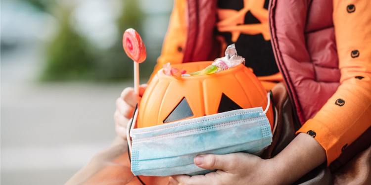 kids with pumpkin candy holder, Creativity is a must, halloween fun and safe for kids, fun and safe celebration, Harvard Global Health Institute, covid risk level, leslie king-schultz, Centers for Disease Control, Minnesota Department of Health