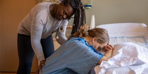 doula helping mom in hospital, what is a doula, midwifes, midwife, support during childbirth, emotional support for moms, claudia beck