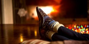woman's slippers on the couch during the holidays, How to cope with grief during the holidays, coping with grief and loss, create rituals and memorials, national alliance of grieving children, grieving a loved one during the holidays, Kenneth J. Doka, PhD, MD, Julia Rajtar
