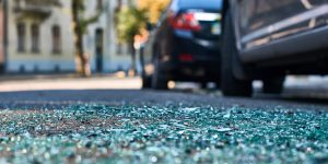broken glass next to a car crash, speeding through the pandemic, fatal crashes are up significantly, trauma prevention on the road, lack of seatbelt use, minnesota department of public safety