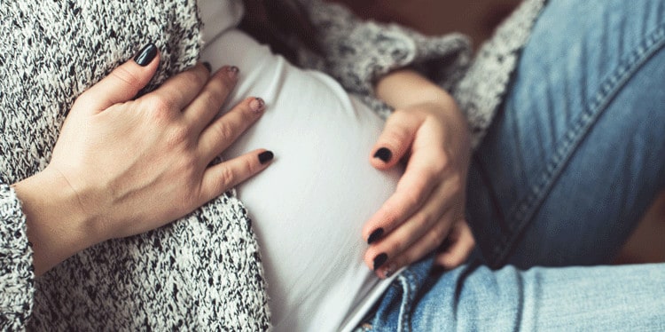 pregnant teen holding her belly, teen pregnancy, pregnant teens, baby blues for pregnant teens, teenage pregnancy, mental health support for pregnant teens