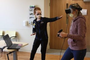 occupational therapist with patient using virtual reality technology, virtual reality technology, occupational therapy technology, new technology for patients, new technology for rehabilitation, ot simulated environment