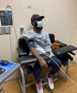 robert a nabors with a mask and sitting in the clinic, Cutting it close with COVID, end-stage renal disease, covid 19 infection, kidney transplant surgeries, black in minneapolis, robert a. nabors