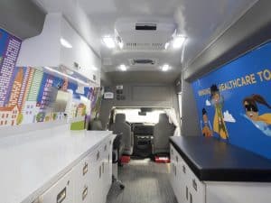 pediatric mobile van interior, mobile clinic brings health care to patients' doors, mobile van healthcare, routine vaccines, pediatric mobile health team, childhood immunizations, bridge a healthcare gap