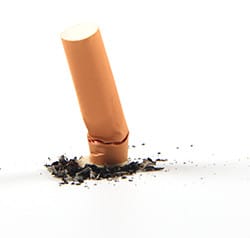 cigarette butt put out on ground, quit smoking, mtm support to quit smoking, medication therapy to stop smoking, pharmacist appointment to stop smoking, 