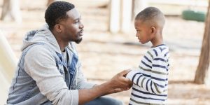 father and son talking, child psychology, how to talk to children, how to talk about traumatic events, how parents talk to children