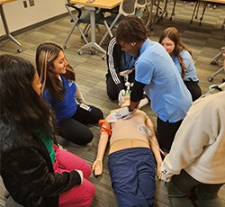 talent garden interns learning cpr in classroom, talent garden interns, shadowing, youth of color, youth summits, healthcare mentorship