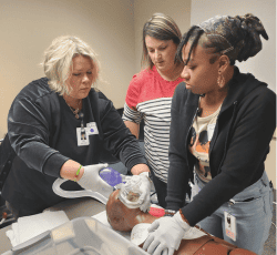 emt trainer with students learning how to apply oxygen to patient, emts embark on intensive training course, domestic call turns into a labor and delivery, assessing the situation, emt license, emt training course, emergency medical care and transportation