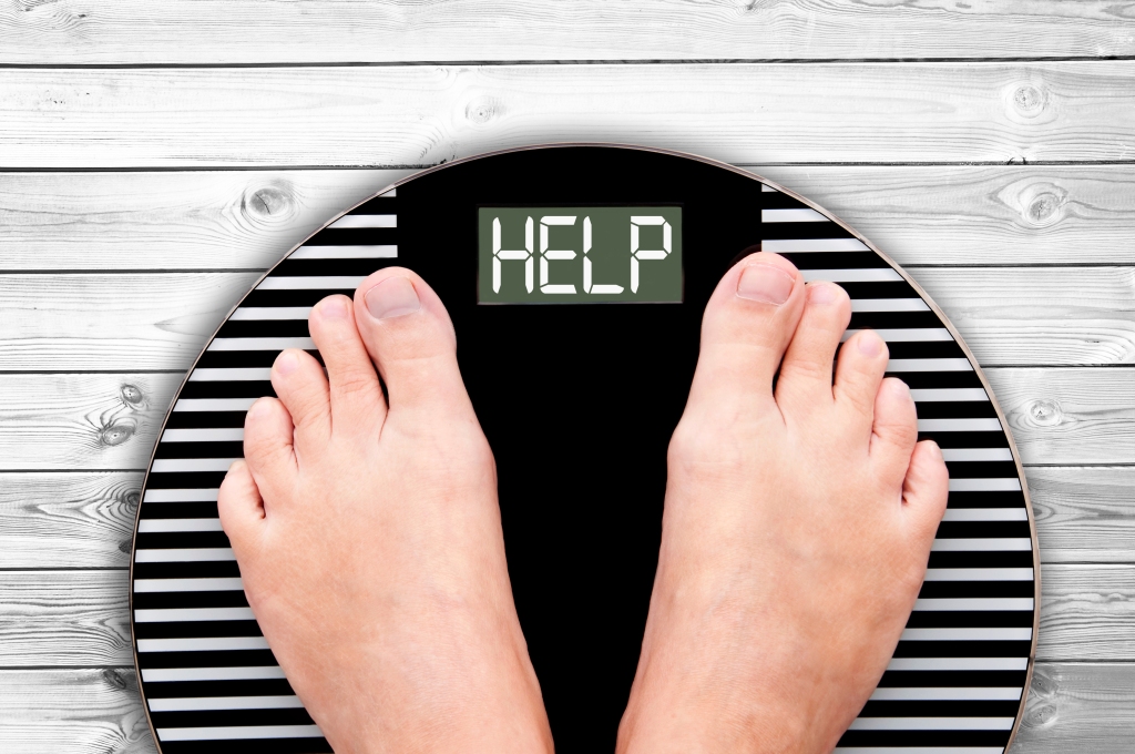 Word Help written on a weight scale, Keeping pounds off after weight loss win, resting metabolism, weight loss surgery, weight management, weight-related health problems such as diabetes