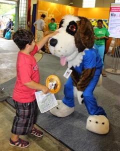 child saying hello to bernie at the minnesota state fair, Visit HCMC at the Fair, hands-on health activities, eye-opening research, healthy matters questions, health information