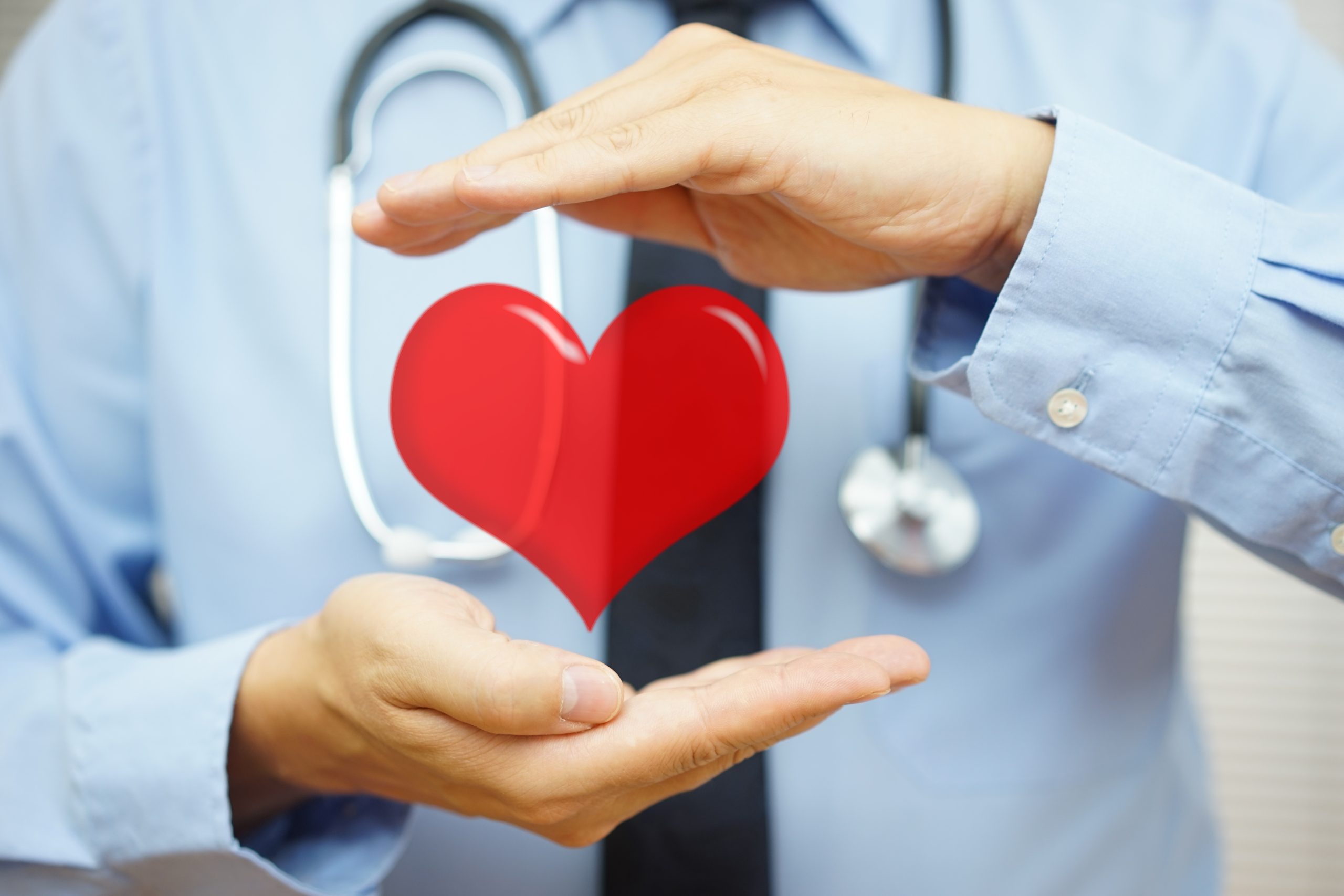 doctor is protecting heart with hands, Did you wake up with high blood pressure on Monday, american college of cardiology, american heart association, blood pressure guidelines, new guidelines for high blood pressure
