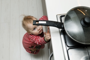 toddler reaching for pan on stove, Preventable injuries, killer and cause of hospitalization, violence, safety practices, prevention of childhood injuries, julie philbrook