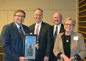 HCMC's Scott Wordelman and Dr. Jon Pryor accepted the award from UCare officials. 