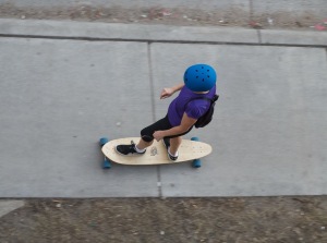 longboarder on sidewalk, Giving foot pain the boot, diagnosis of plantar fasciitis, podiatrist, orthotic inserts, supportive shoes with good arch support