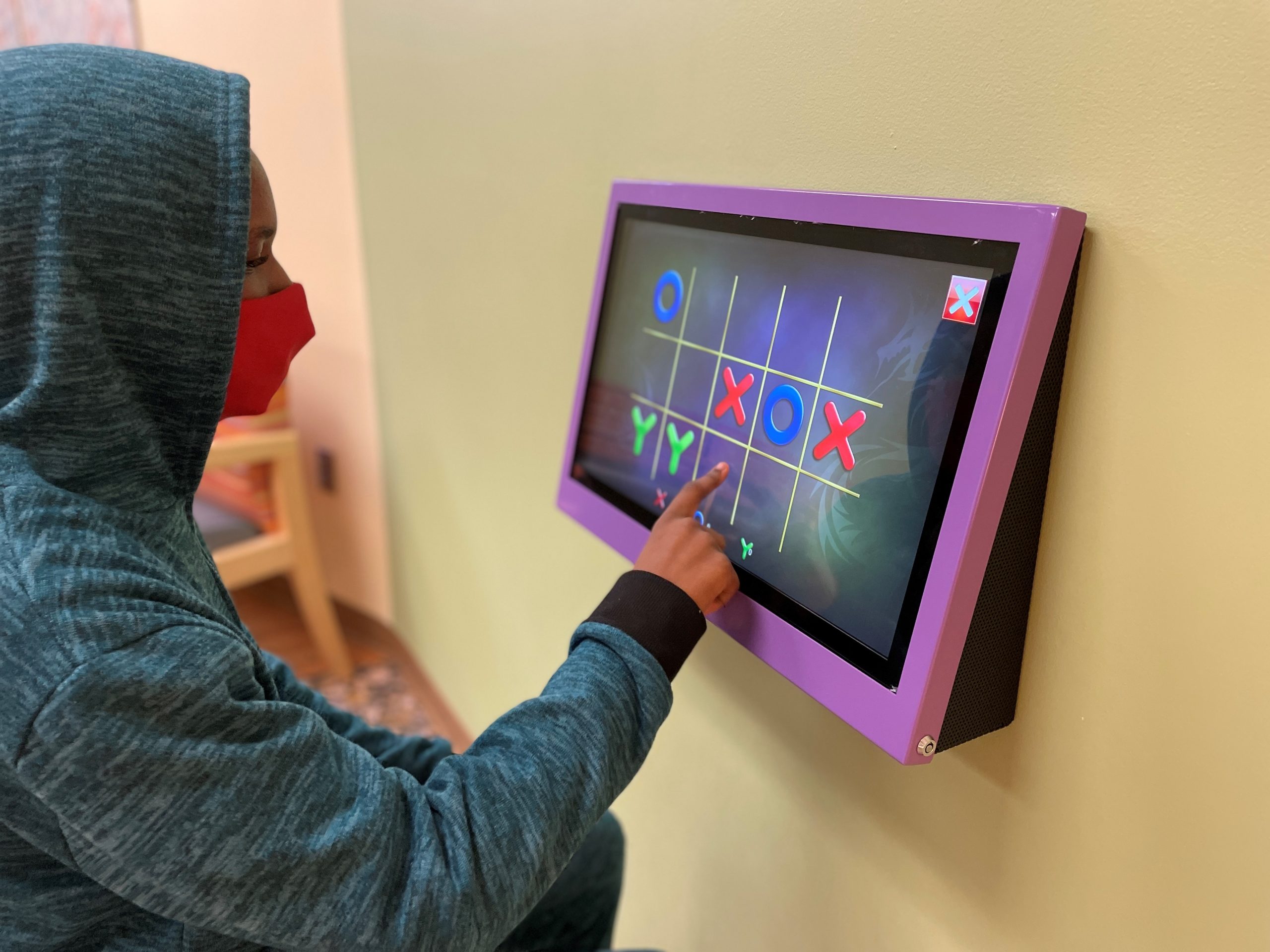 Young patient interacting with digital toy, Grant from The Toy Foundation, Emergency Department, play programs for children, help hospitalized children heal, Level I Pediatric Trauma Center, Child Life Program Coordinator Alyson Weiss